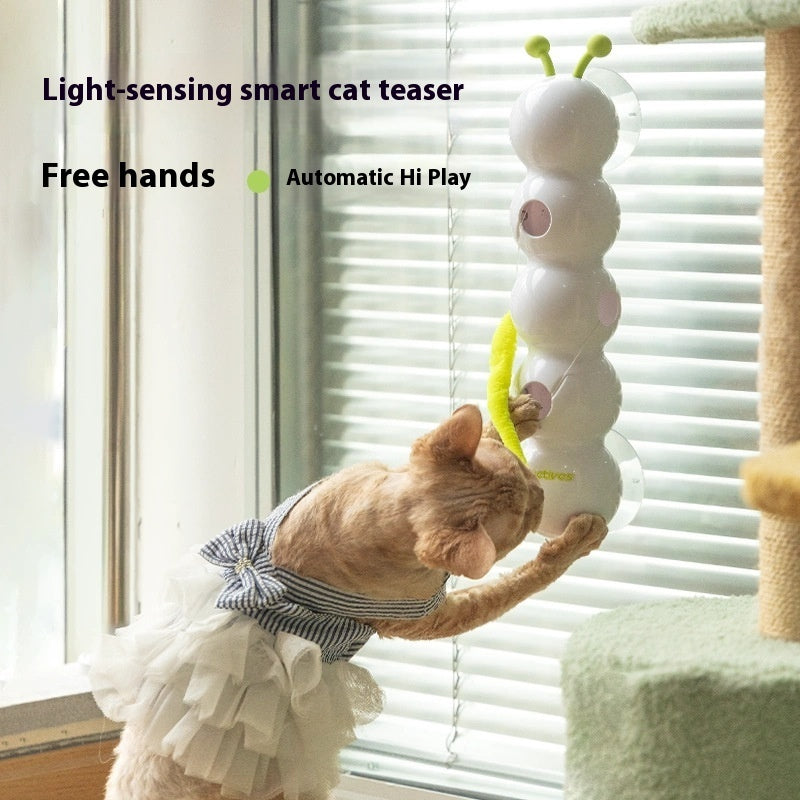 Cat playing with an automatic interactive cat toy, a light-sensing smart teaser that promotes play.
