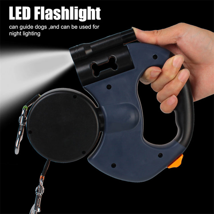 Hand holding a retractable dog leash for small dogs with an LED flashlight feature for night safety.
