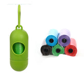 dog poop bags for cleanup with green dispenser and colorful trash bags in a stack.