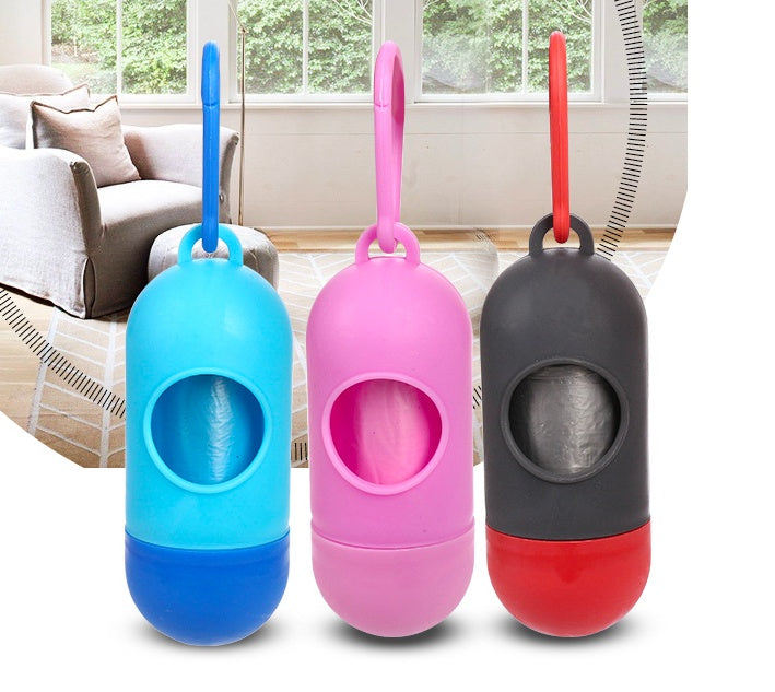 dog poop bags for cleanup in blue, pink, and black holders displayed in a cozy interior setting.