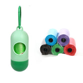 Dog poop bags for cleanup in assorted colors and a dispenser for easy access.
