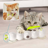 Cat playing with automatic interactive cat toy, engaging and entertaining with hunting instincts.