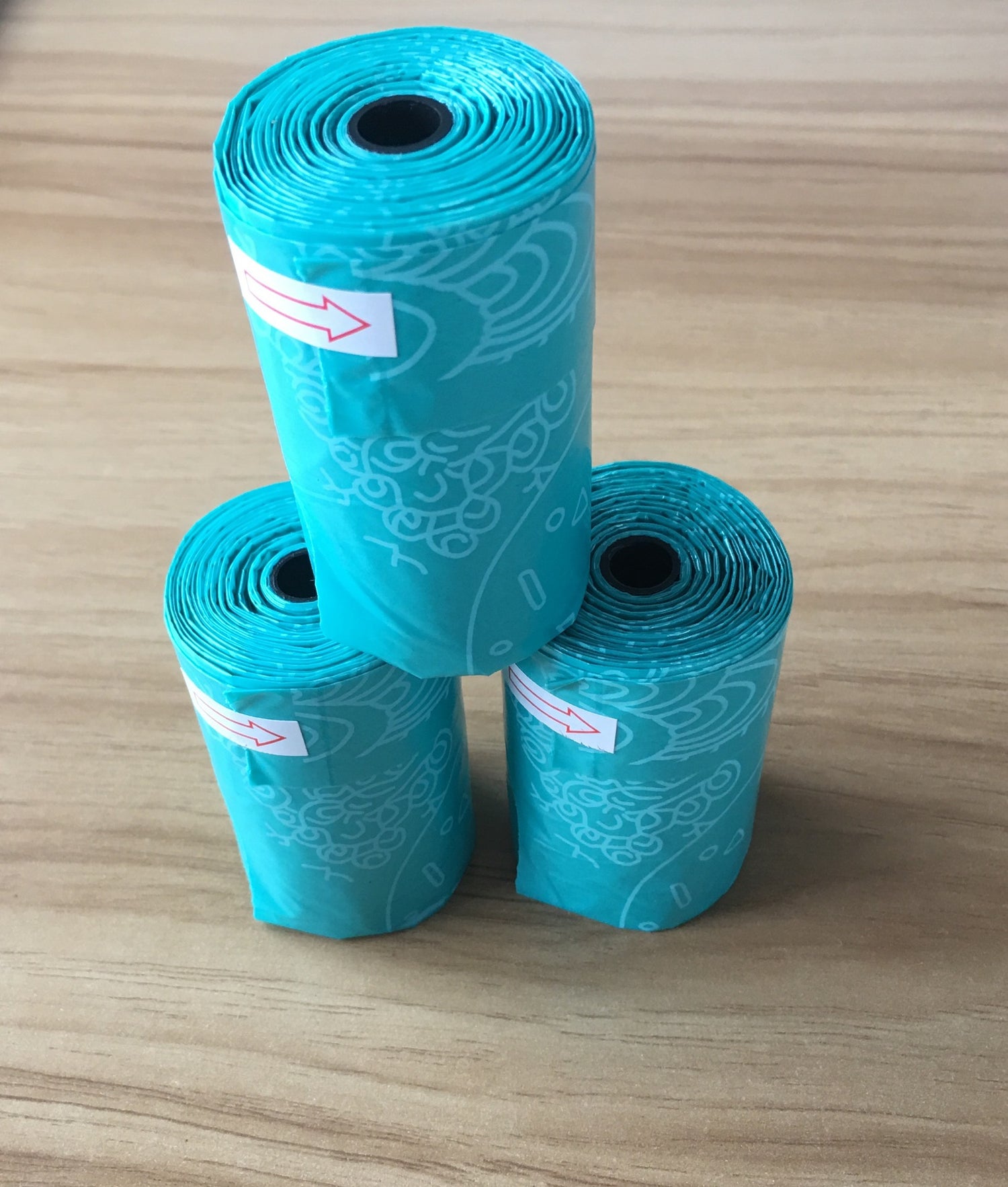 cat litter storage box with shovel featuring three rolls of teal waste bags for easy clean-up