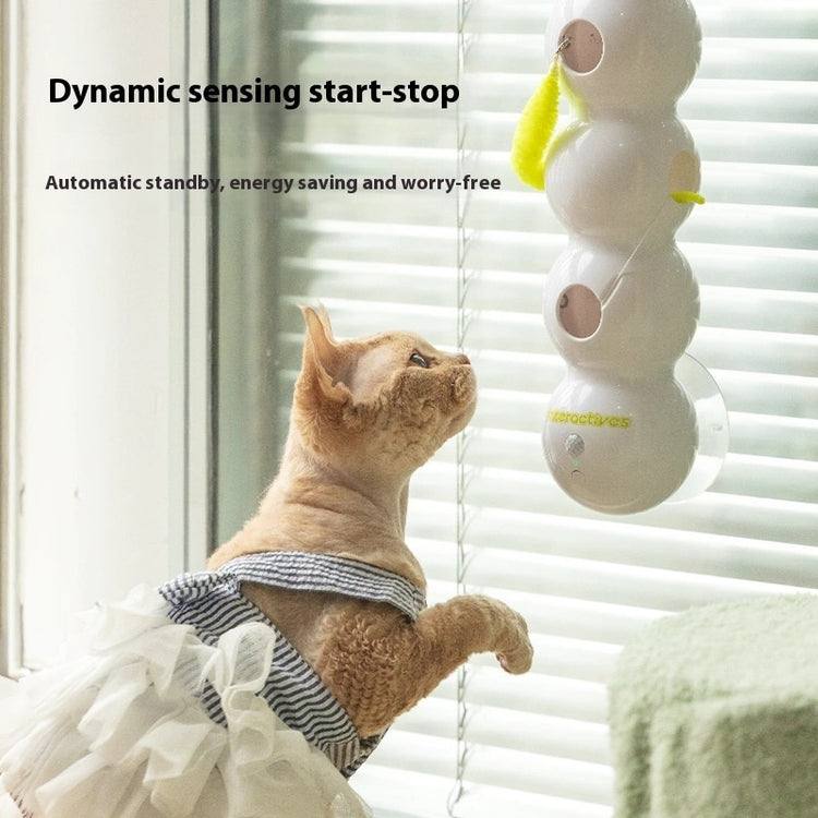 Cat engaging with an automatic interactive cat toy designed for entertainment and exercise.