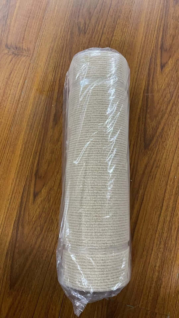 Self-Adhesive Carpet Cats Scratch Board for Sofa Protection roll wrapped in plastic on wooden surface.
