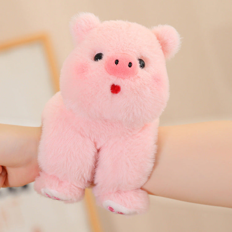 adorable plush animal dolls featuring a cute pink pig plush toy cuddled by a hand.