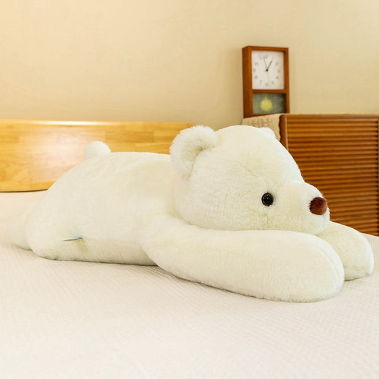 Adorable bear plush pillow resting on a bed, perfect for snuggling and enhancing sleep quality.