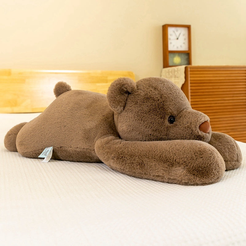 Bear plush pillow resting on a cozy bed, perfect for cuddling and enhancing sleep quality.