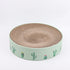 durable cat scratch board featuring a round design with cactus illustrations on a green base.