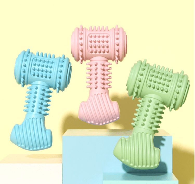 Colorful indestructible dog chew toys in blue, pink, and green, designed for tough chewers and durable play.