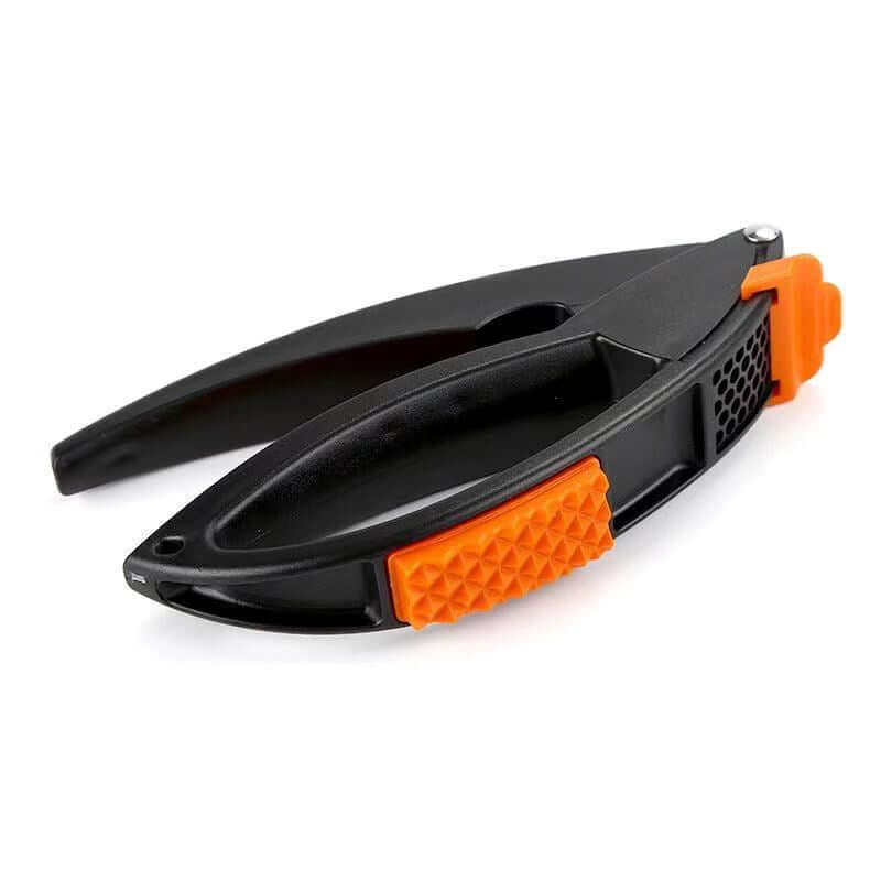 Manual Multifunctional Household Garlic Press Set Kitchen - black and orange garlic press for easy garlic crushing.